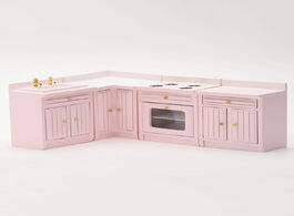 Foto van Speelgoed dollhouse miniature 1:12 scale four piece kitchen cabinet furniture set in pink