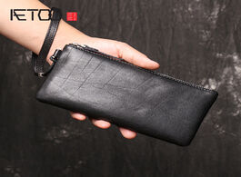 Foto van Tassen aetoo men s leather zero wallet soft large capacity handbag thin mobile phone bag.