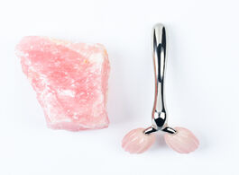 Foto van Schoonheid gezondheid natural rose quartz stone 3d roller face lifting artifact y shaped beauty mass