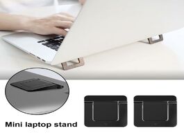 Foto van Computer mini foldable laptop holder adjustable cooling stand portable invisible tablet table suppor