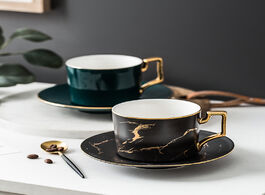 Foto van Huis inrichting luxury gold inlay marble design white black green color coffee cup and saucer latte 