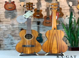 Foto van Sport en spel 26 inch solid ukulele 4 string hawaiian guitar concert professional uk2640