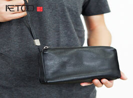 Foto van Tassen aetoo men s leather handbags first layer simple clutches zippered mobile phone bags large cap