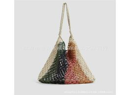 Foto van Tassen 46x32cm hollow shoulder handbag day style mesh bag beach hand woven panelled colors cotton to