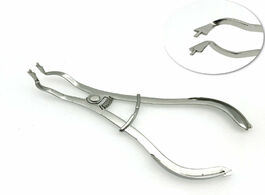 Foto van Schoonheid gezondheid rubber dam clamps ivory clamp forceps dental restorative instruments
