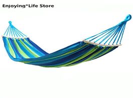 Foto van Meubels outdoor hammock idyllic swing chair single thick canvas blue stripes curved stick 280x80