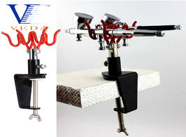 Foto van Gereedschap airbrush holder clamp on stand holds 2 airbrushes hobby spray gun parts table bench top 