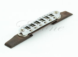 Foto van Sport en spel adjustable chrome rosewood bridge roller saddles for les paul jazz guitar