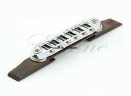 Foto van Sport en spel adjustable chrome rosewood bridge roller saddles for jazz guitar drop ship
