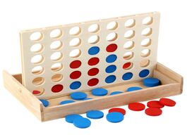 Foto van Speelgoed 4 in a row. four row wooden game line up classic family toy board for kids and fun