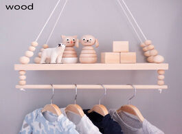 Foto van Huis inrichting nordic wooden wall shelf with clothes rack children room craft storage rope hanging 