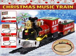 Foto van Speelgoed christmas train set railway rail tracks toys electric with locomotive engine cars lights a