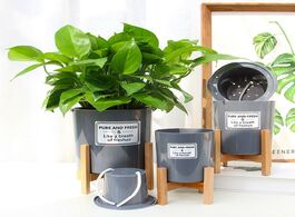 Foto van Meubels wooden four legged flower stand strong durable free holder plant pot shelf tray bonsai displ